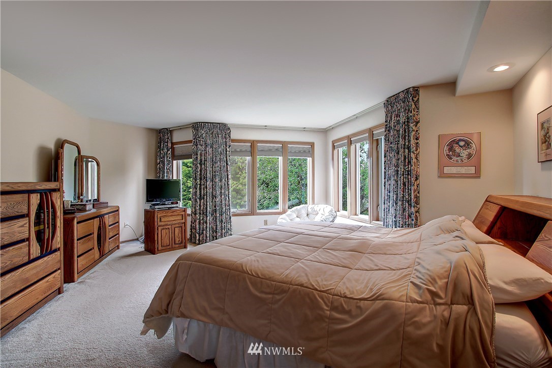 2019 237th Place Southeast Bothell, WA 98021 - Photo 18 of 26 a bed sitting in a bedroom next to a window