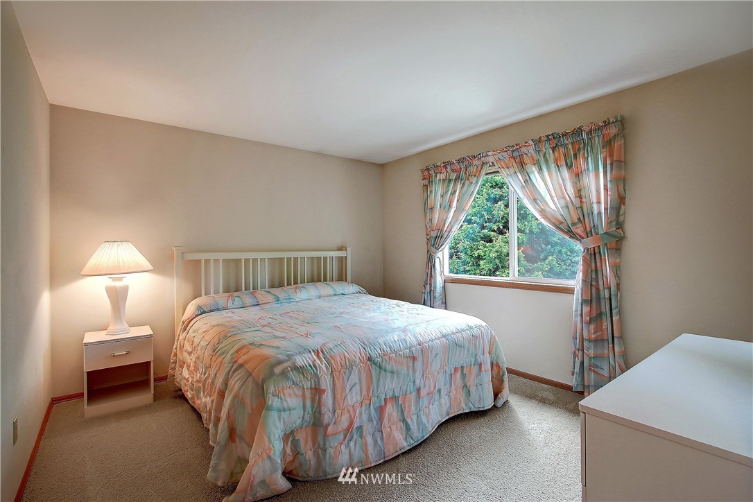 2019 237th Place Southeast Bothell, WA 98021 - Photo 21 of 26 a bedroom with a bed and a window