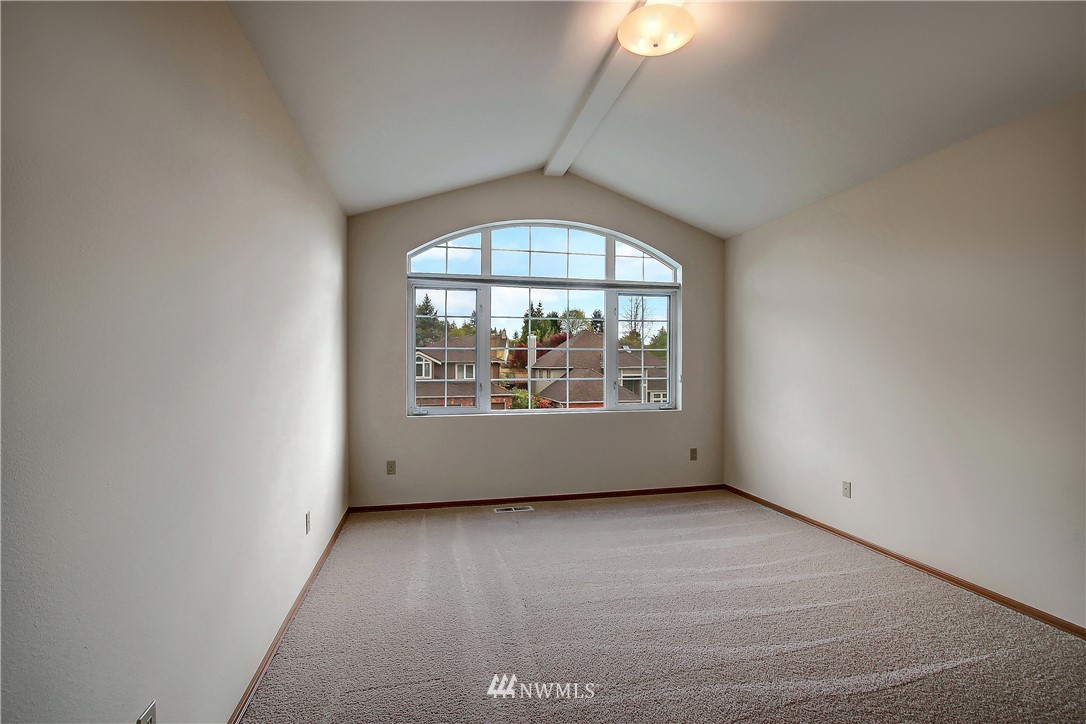 2019 237th Place Southeast Bothell, WA 98021 - Photo 24 of 26 an empty room with wooden floor and windows