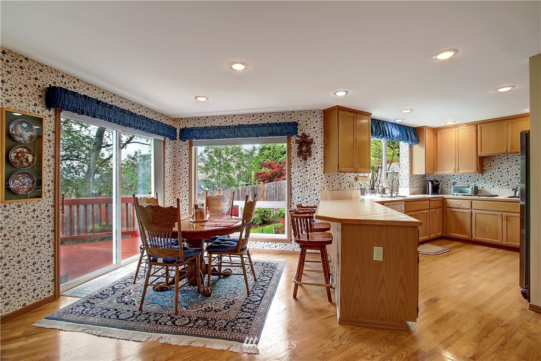 2019 237th Place Southeast Bothell, WA 98021 - Photo 4 of 26 a view of a dining room with furniture and wooden floor