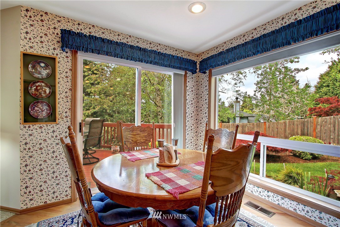 2019 237th Place Southeast Bothell, WA 98021 - Photo 7 of 26 a dining room with furniture and a floor to ceiling window