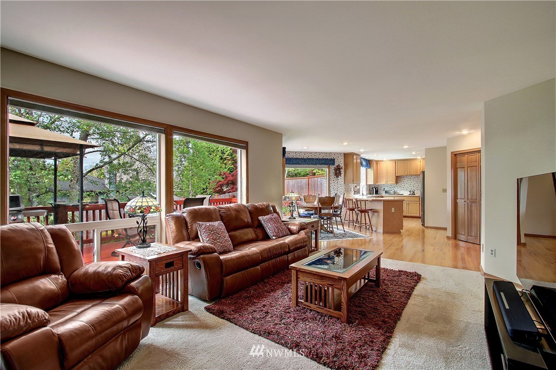 2019 237th Place Southeast Bothell, WA 98021 - Photo 10 of 26 a living room with furniture flat screen tv and a large window
