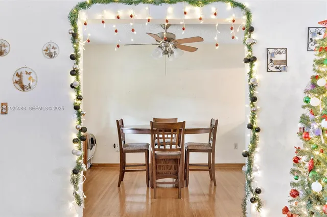 a view of a dining room with furniture and wooden floor