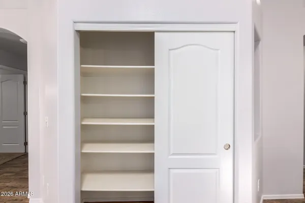 a view of an empty room with a bathroom
