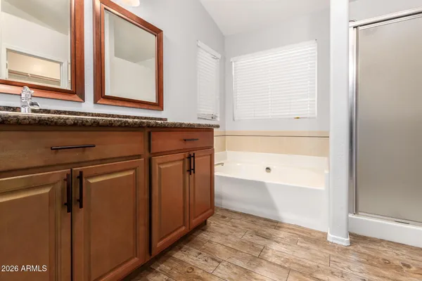 a bathroom with a bathtub and a sink