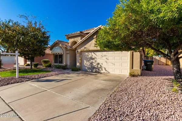 a view of a house with a street