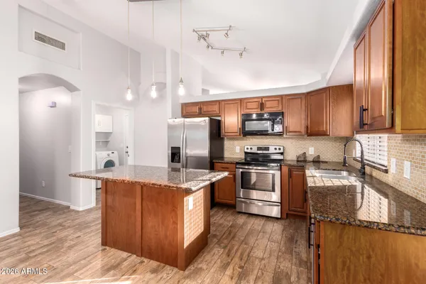 a view of a kitchen and a chandelier