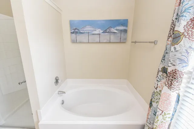 a white bath tub sitting in a bathroom