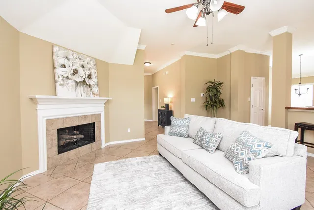 a living room with furniture and a fireplace