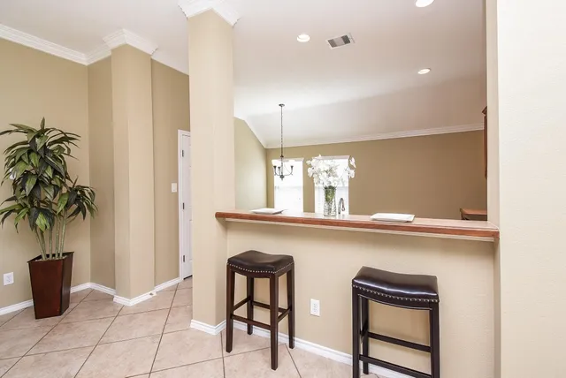 a kitchen with a table and chairs in it
