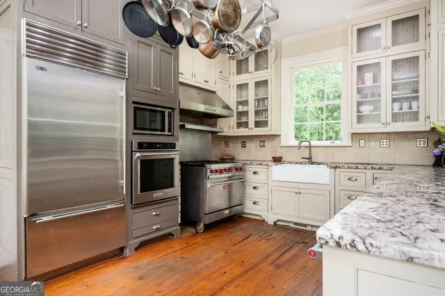 a bedroom with a bed and furniture
