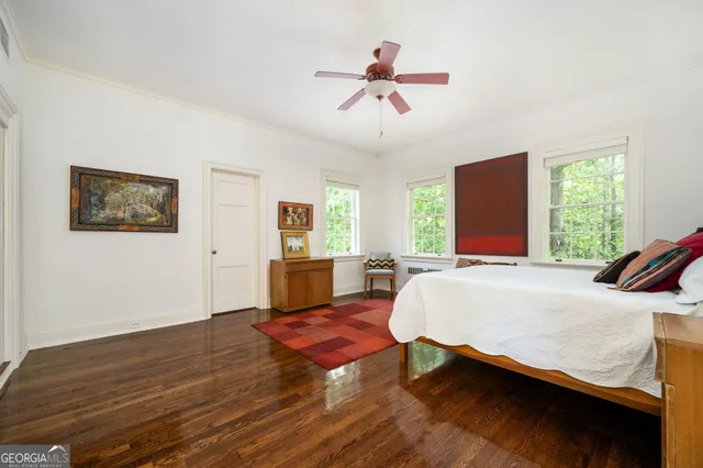 an aerial view of residential house with outdoor space and trees all around