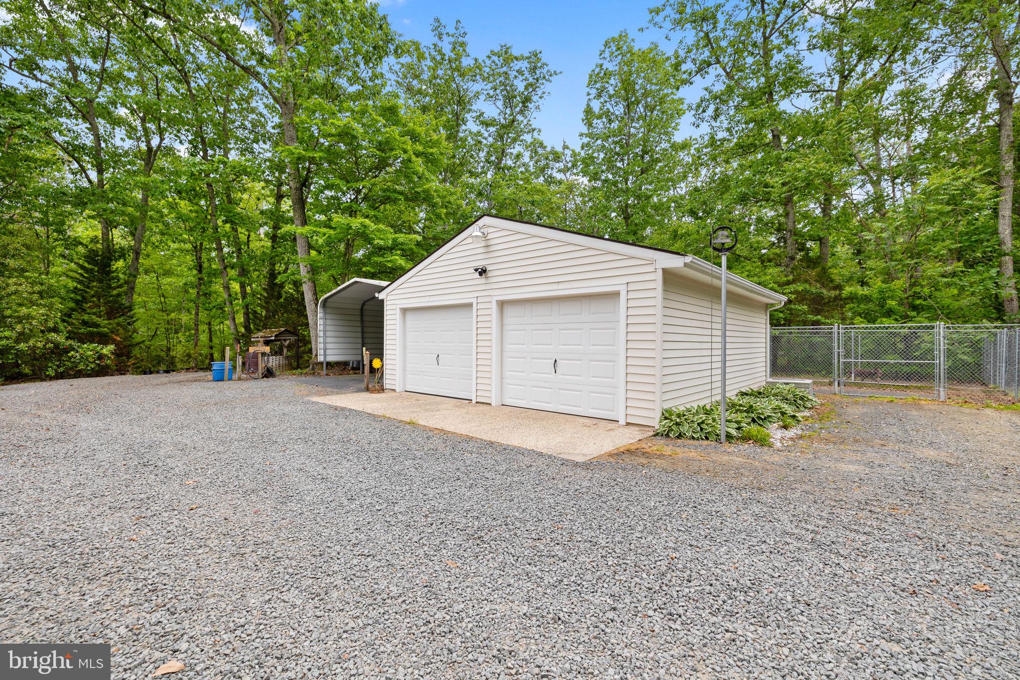 5099 Courtneys Corner Road Sumerduck, VA 22742 - Photo 21 of 52 a view of a house with a yard and garage