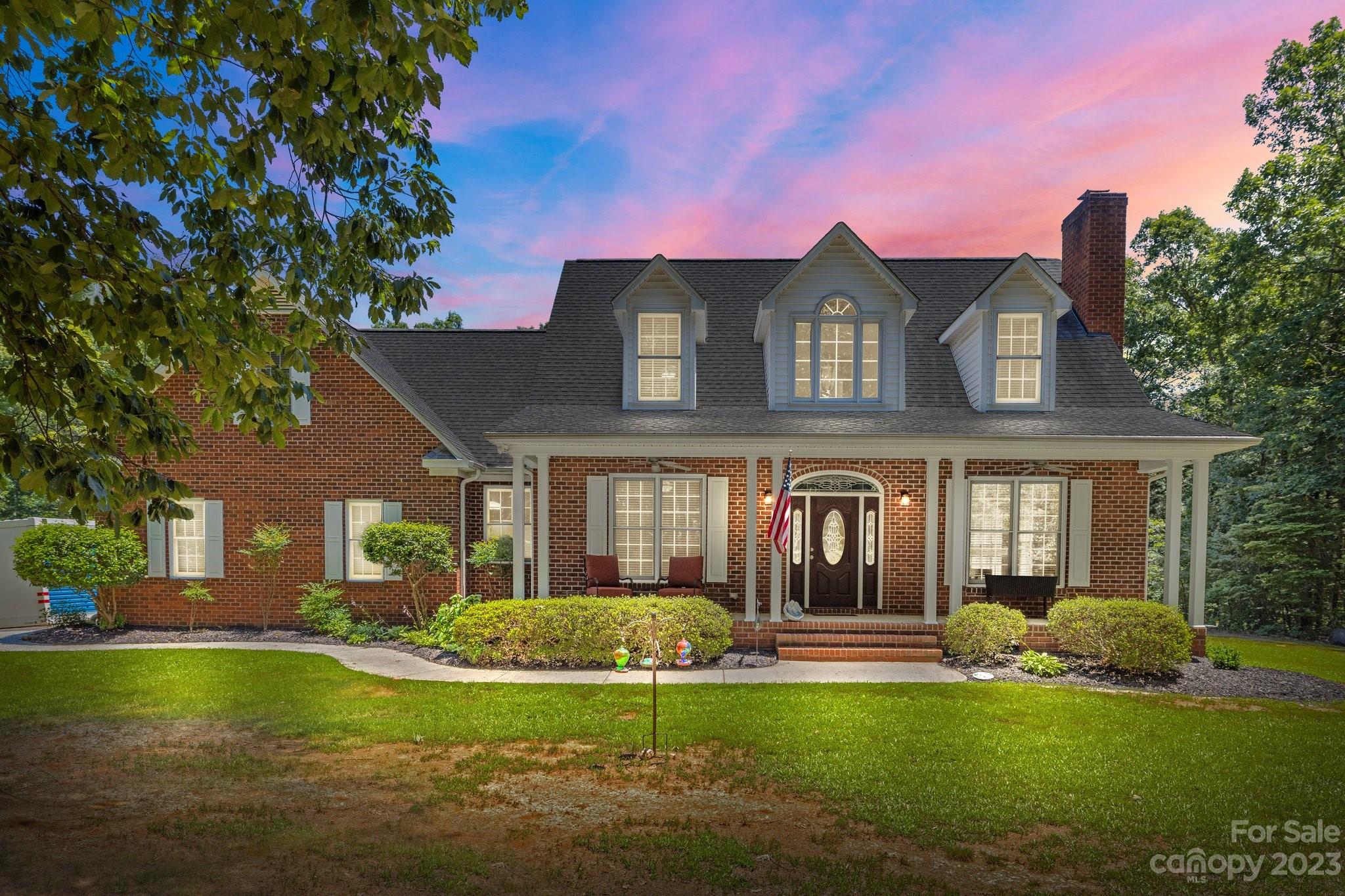1300 Dutch Road Mount Pleasant, NC 28124 - Photo 1 of 41 a front view of a house with swimming pool having outdoor seating
