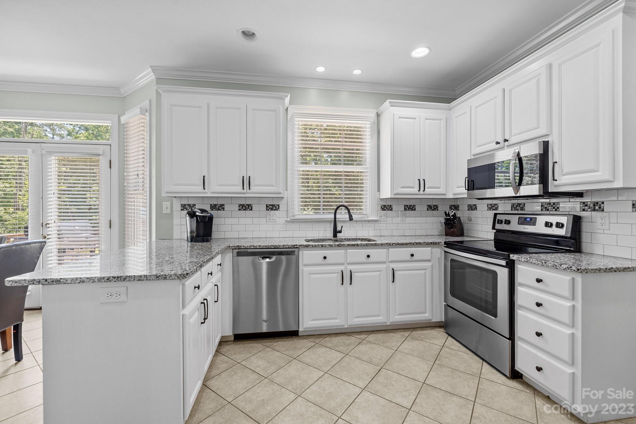 1300 Dutch Road Mount Pleasant, NC 28124 - Photo 14 of 41 a kitchen with appliances cabinets and a sink