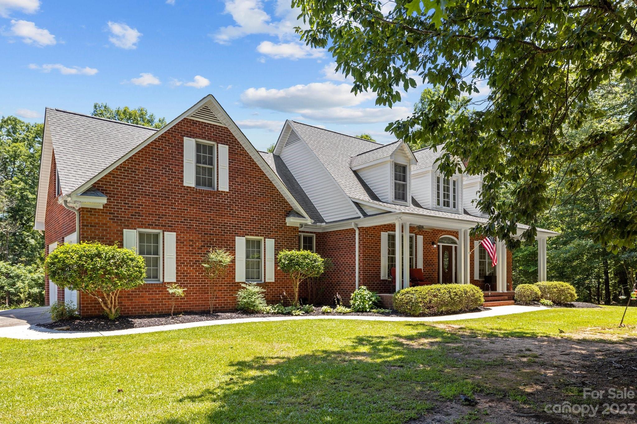 1300 Dutch Road Mount Pleasant, NC 28124 - Photo 2 of 41 a front view of a house with a yard