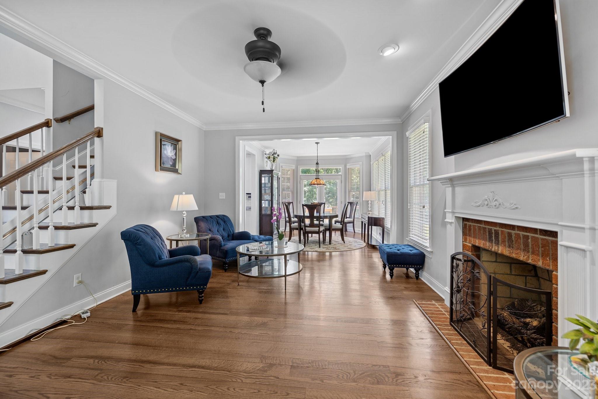 1300 Dutch Road Mount Pleasant, NC 28124 - Photo 21 of 41 a living room with furniture a flat screen tv and a fireplace