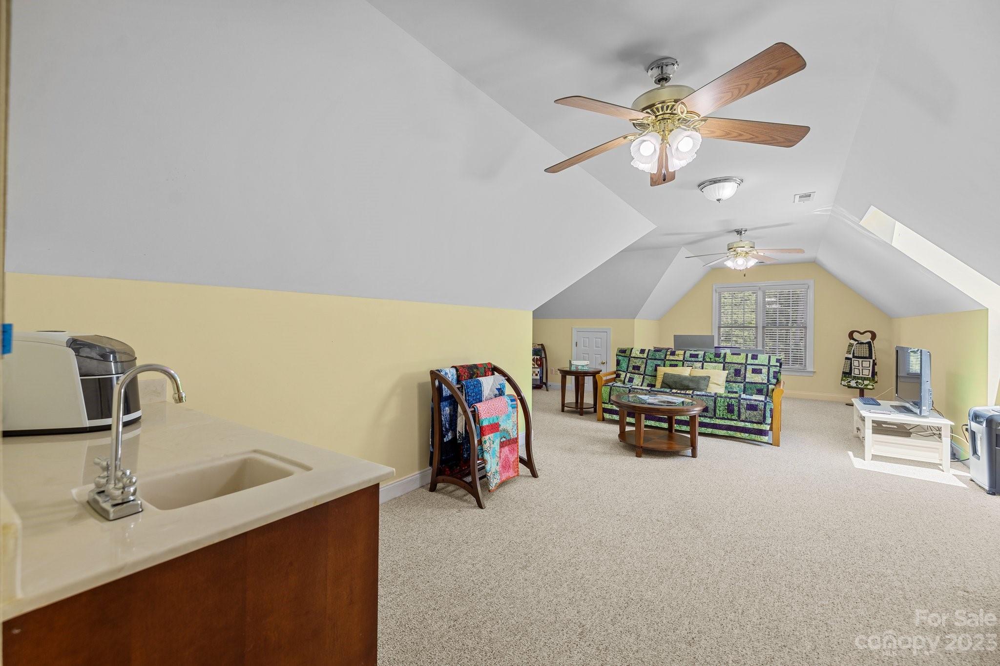 1300 Dutch Road Mount Pleasant, NC 28124 - Photo 26 of 41 a living room with furniture and a chandelier