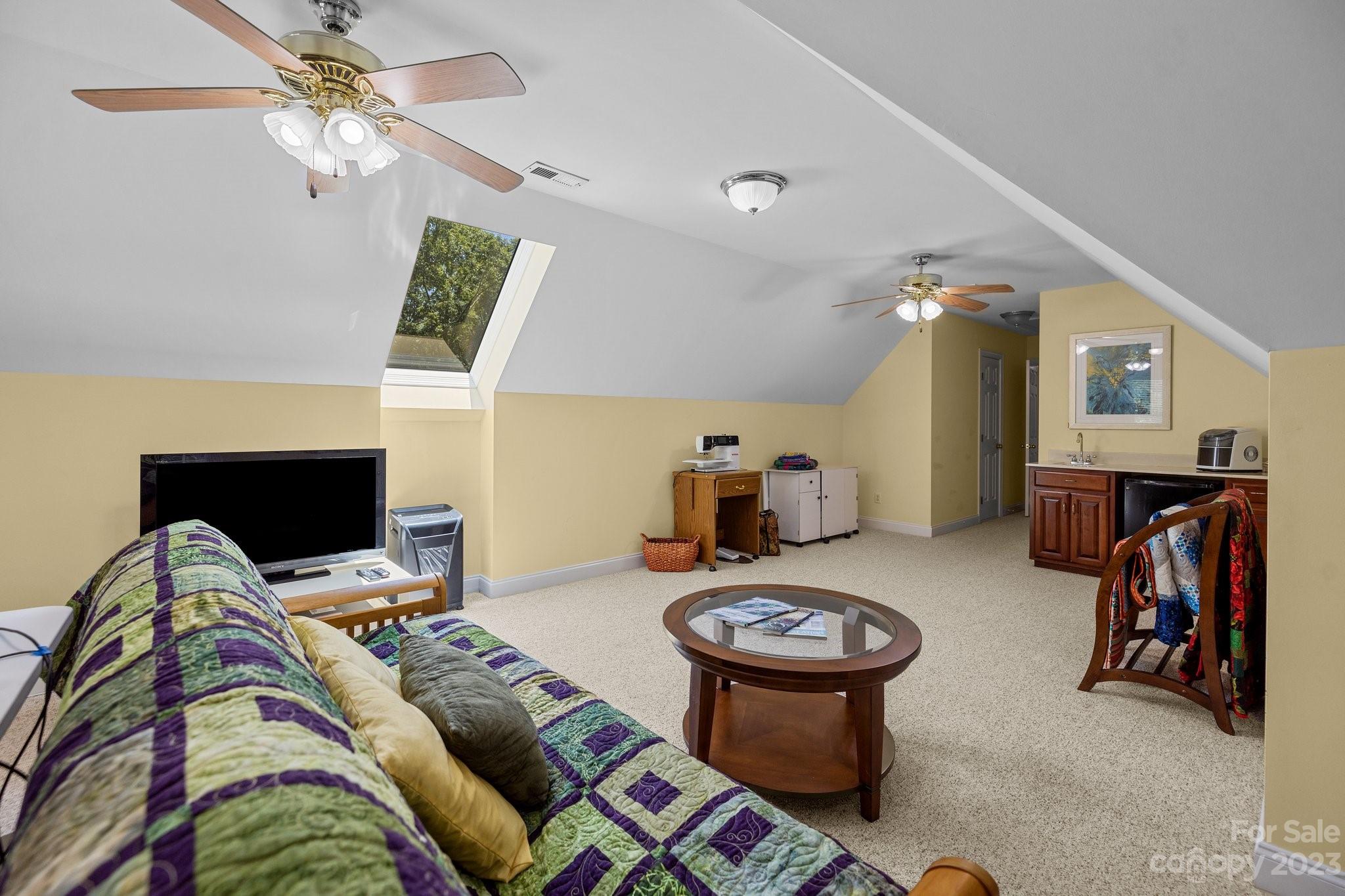 1300 Dutch Road Mount Pleasant, NC 28124 - Photo 27 of 41 a bedroom with furniture and a chandelier