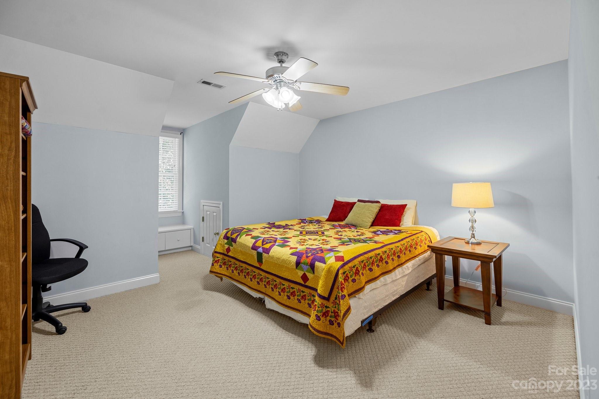 1300 Dutch Road Mount Pleasant, NC 28124 - Photo 30 of 41 a bedroom with a bed and a chandelier