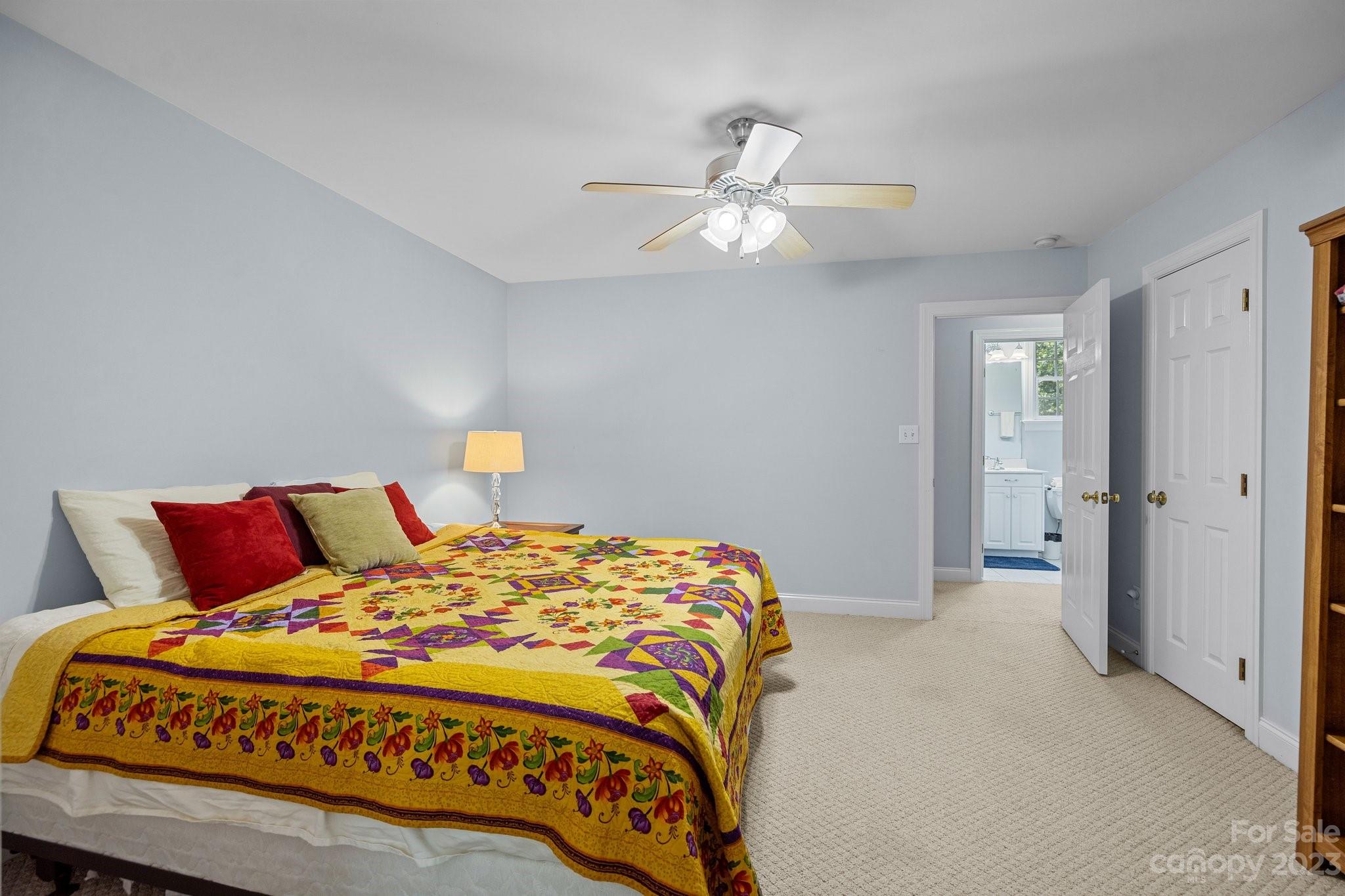 1300 Dutch Road Mount Pleasant, NC 28124 - Photo 31 of 41 a bedroom with a bed and a chandelier