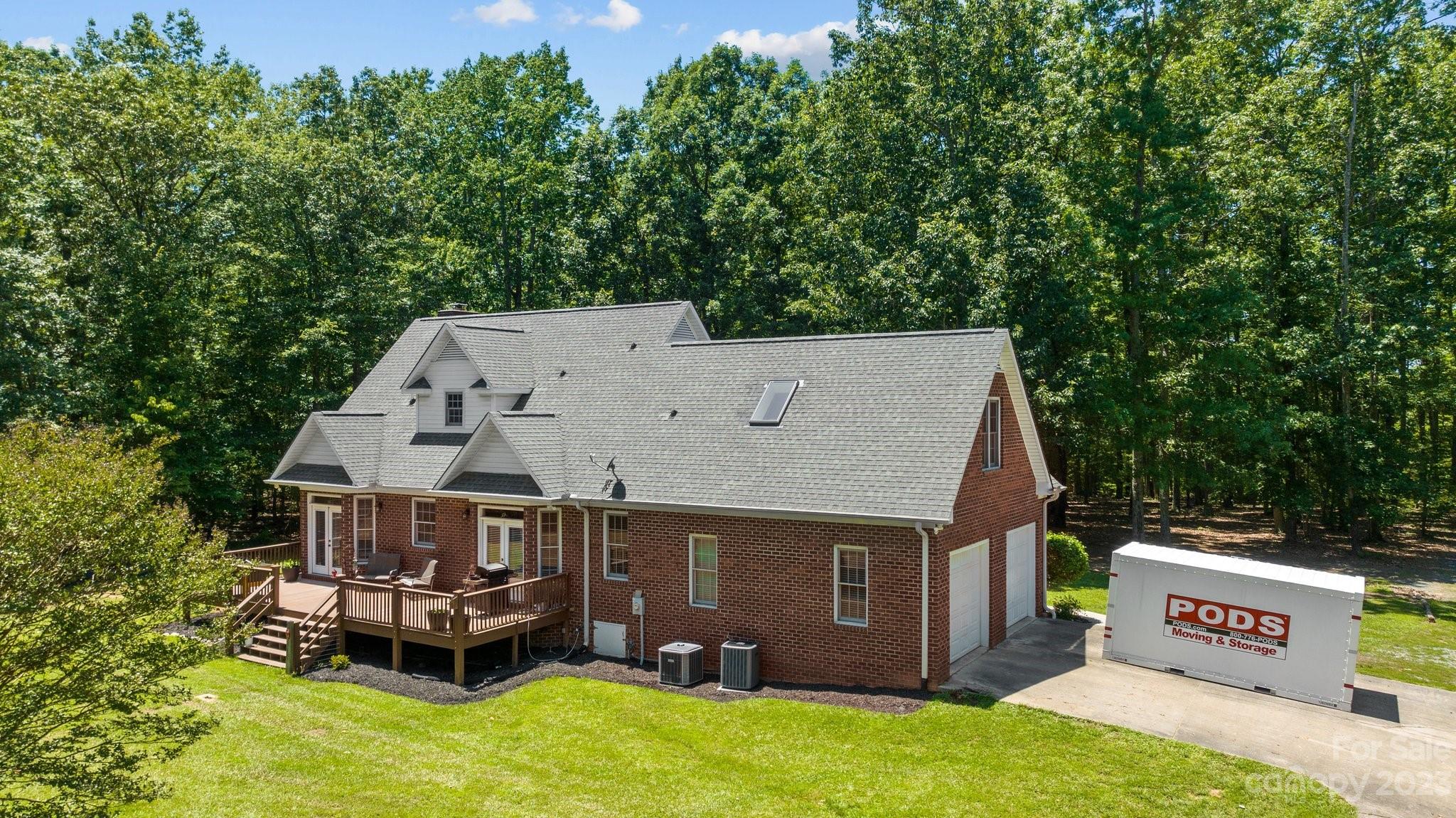 1300 Dutch Road Mount Pleasant, NC 28124 - Photo 34 of 41 an aerial view of a house with table and chairs a fire pit