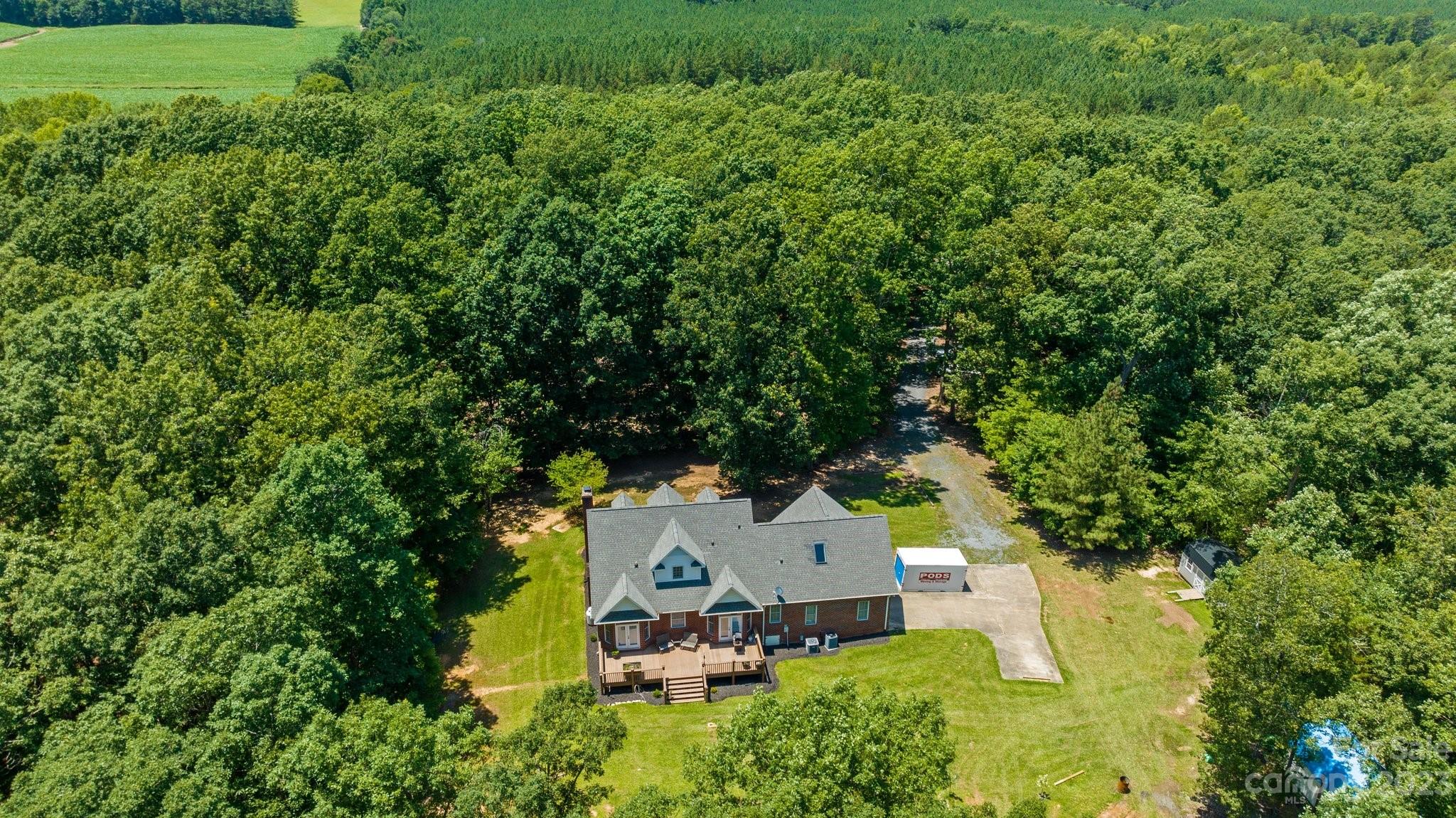 1300 Dutch Road Mount Pleasant, NC 28124 - Photo 36 of 41 an aerial view of a house with swimming pool a yard and mountain view