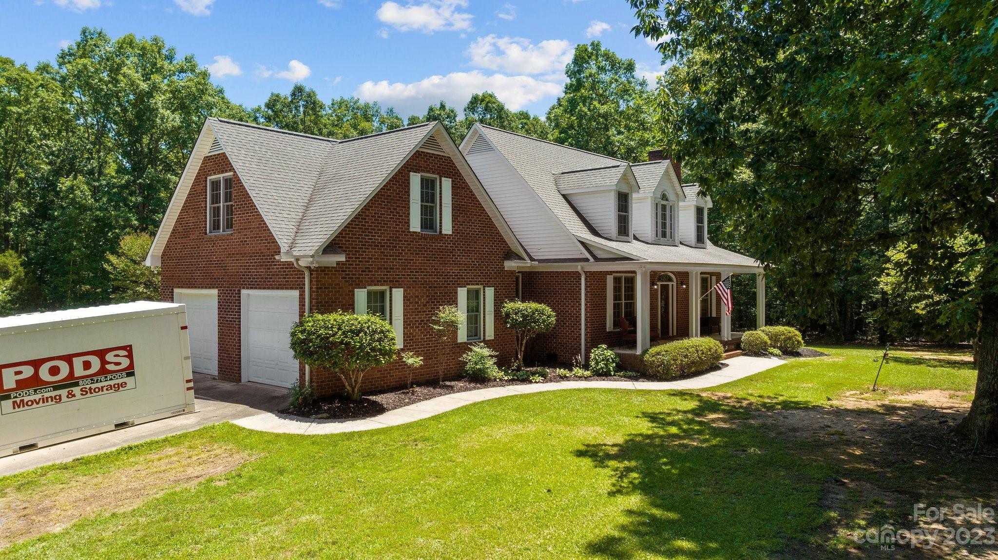 1300 Dutch Road Mount Pleasant, NC 28124 - Photo 4 of 41 a front view of a house with a yard