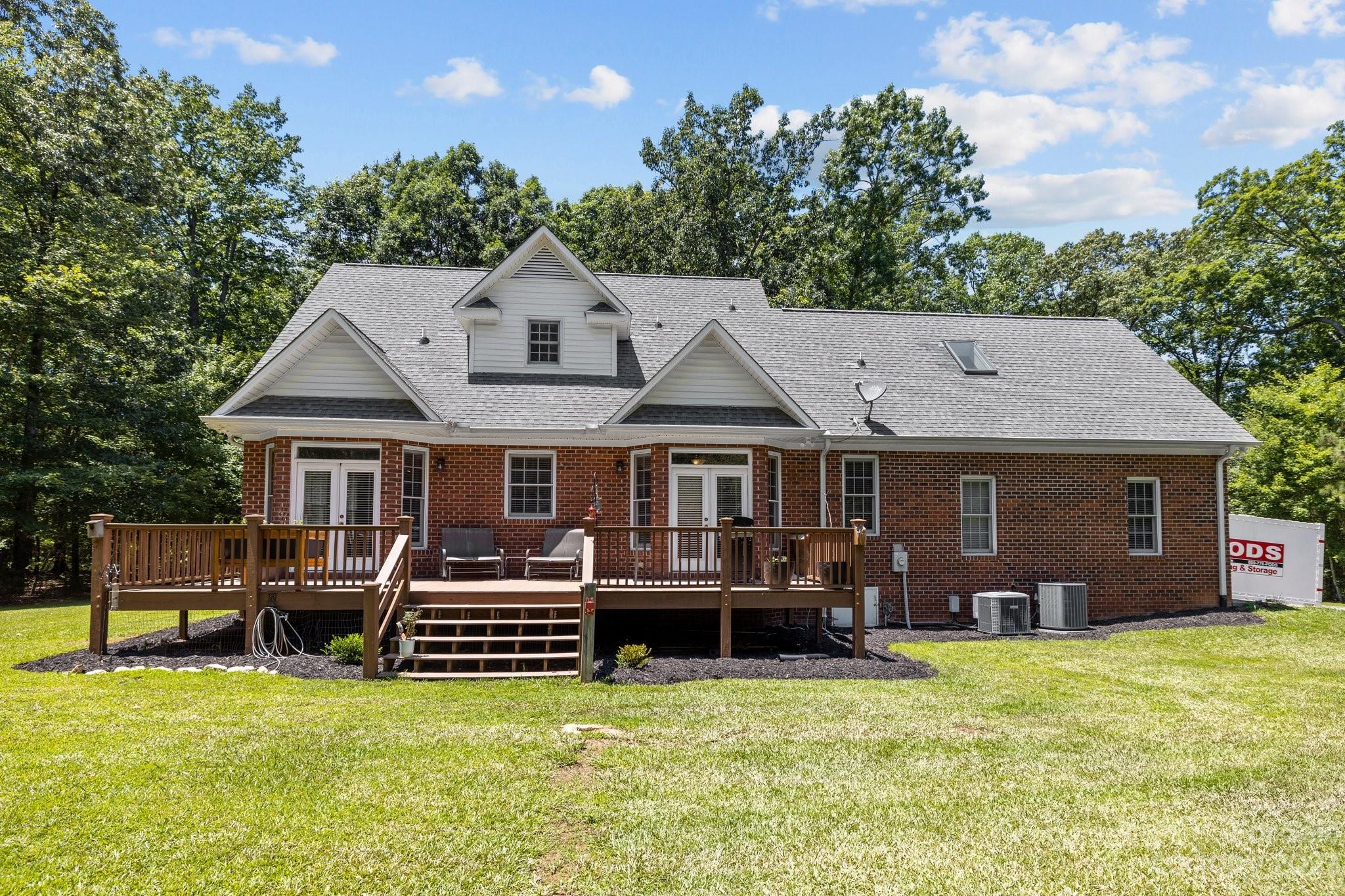 1300 Dutch Road Mount Pleasant, NC 28124 - Photo 6 of 41 a front view of a house with a garden and trees