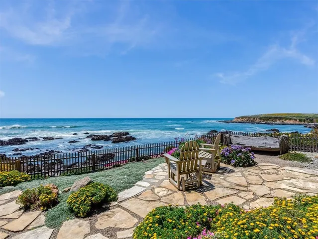 a view of a chairs and table in the patio