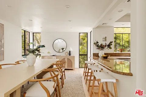 a view of a livingroom with furniture and windows