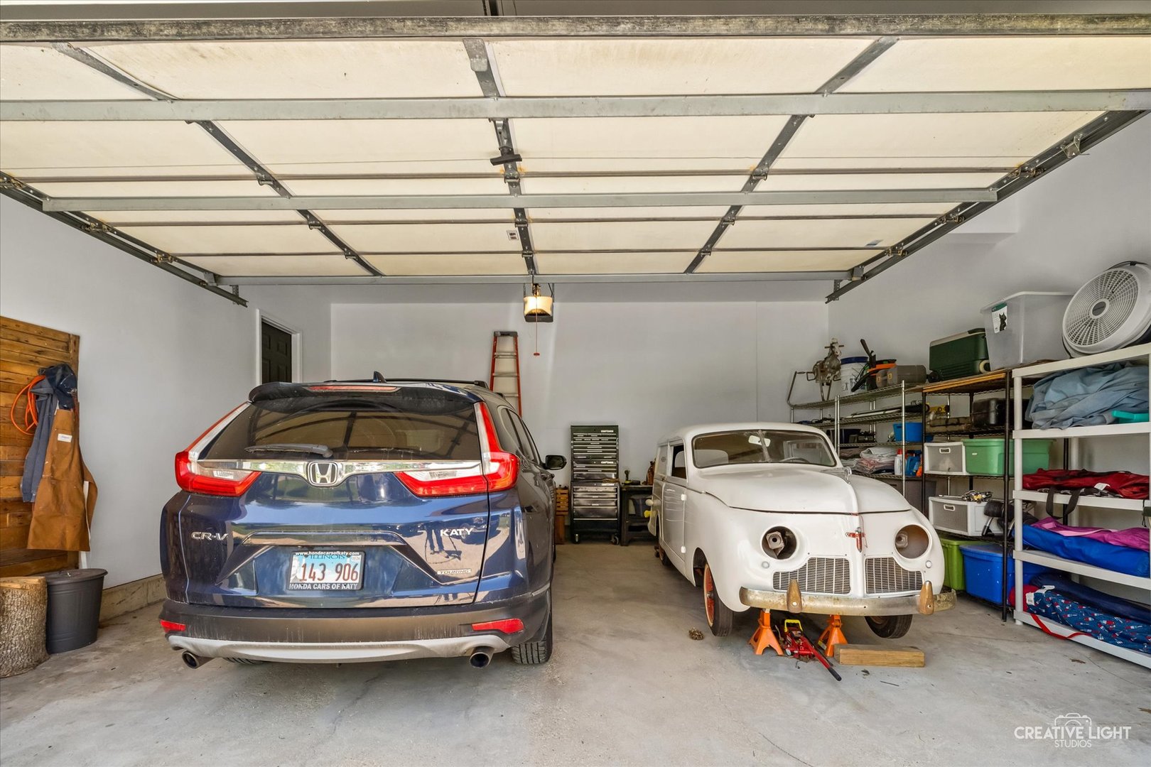 13495 Fennel Road Newark, IL 60541 - Photo 35 of 43 a car and bike parked in a garage