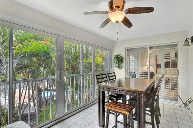 a dining room with furniture window and outside view