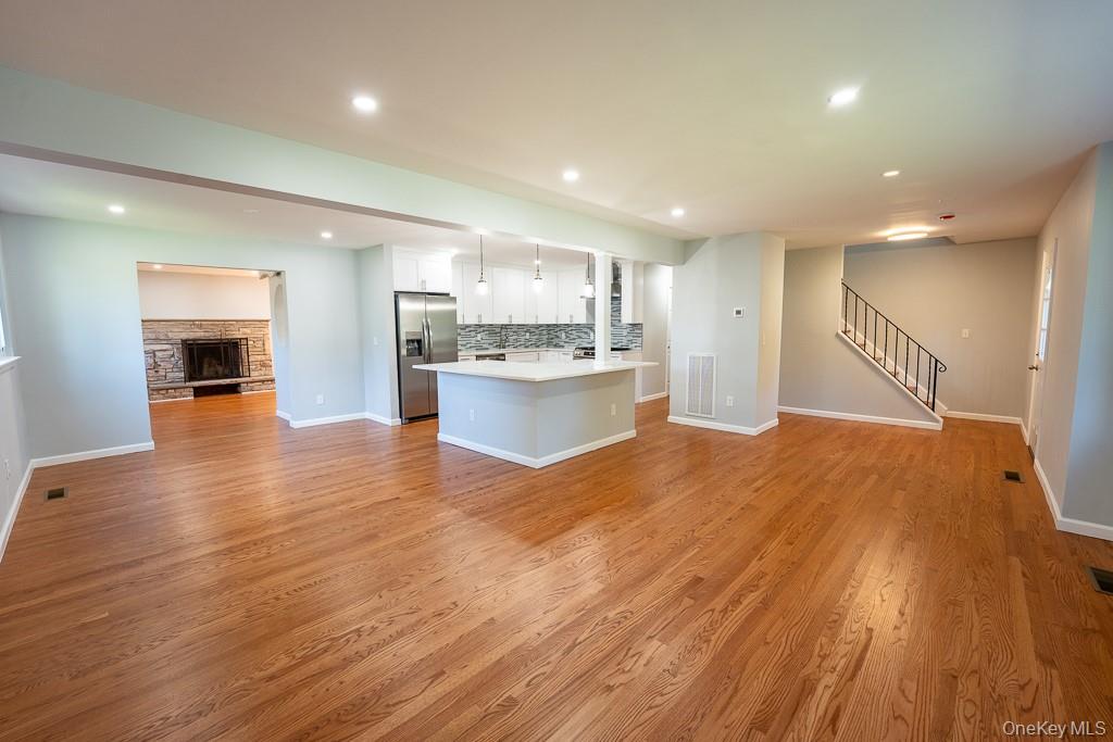 25 Robin Road Poughkeepsie, NY 12601 - Photo 36 of 37 a big room with wooden floor and windows