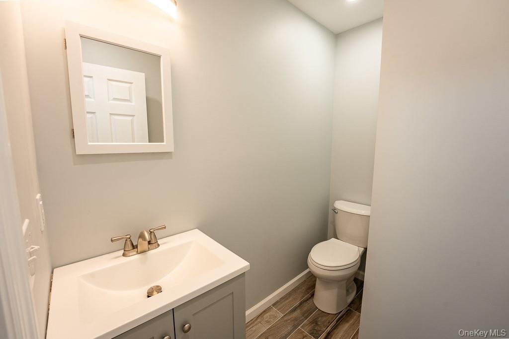 25 Robin Road Poughkeepsie, NY 12601 - Photo 19 of 37 a bathroom with a toilet sink and mirror
