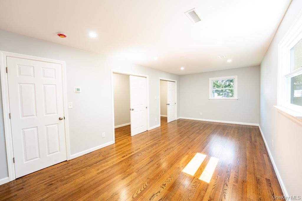 25 Robin Road Poughkeepsie, NY 12601 - Photo 20 of 37 a view of empty room with wooden floor and fan