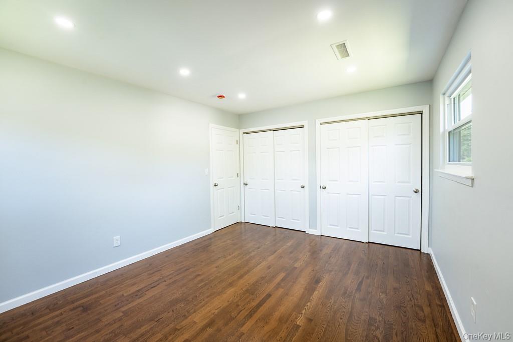 25 Robin Road Poughkeepsie, NY 12601 - Photo 27 of 37 a view of an empty room with wooden floor