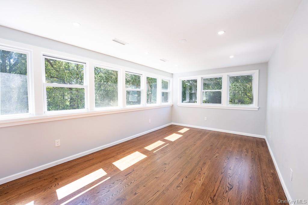 25 Robin Road Poughkeepsie, NY 12601 - Photo 30 of 37 a view of an empty room with wooden floor and a window