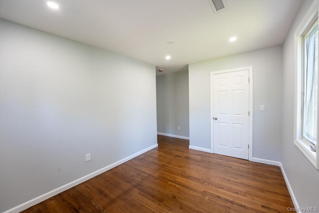 25 Robin Road Poughkeepsie, NY 12601 - Photo 31 of 37 a view of an empty room with wooden floor and a window
