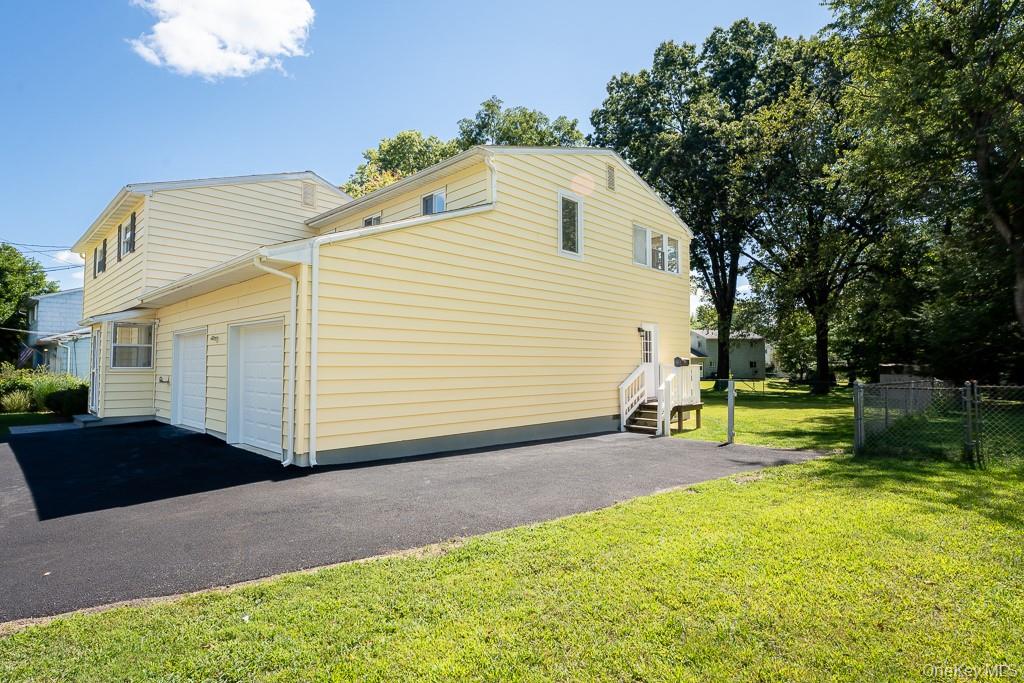 25 Robin Road Poughkeepsie, NY 12601 - Photo 7 of 37 a view of a house with backyard and a garden