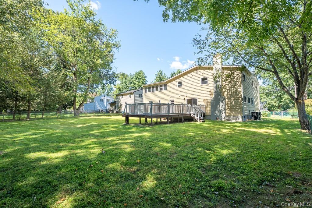 25 Robin Road Poughkeepsie, NY 12601 - Photo 9 of 37 a view of a house with a big yard and large trees