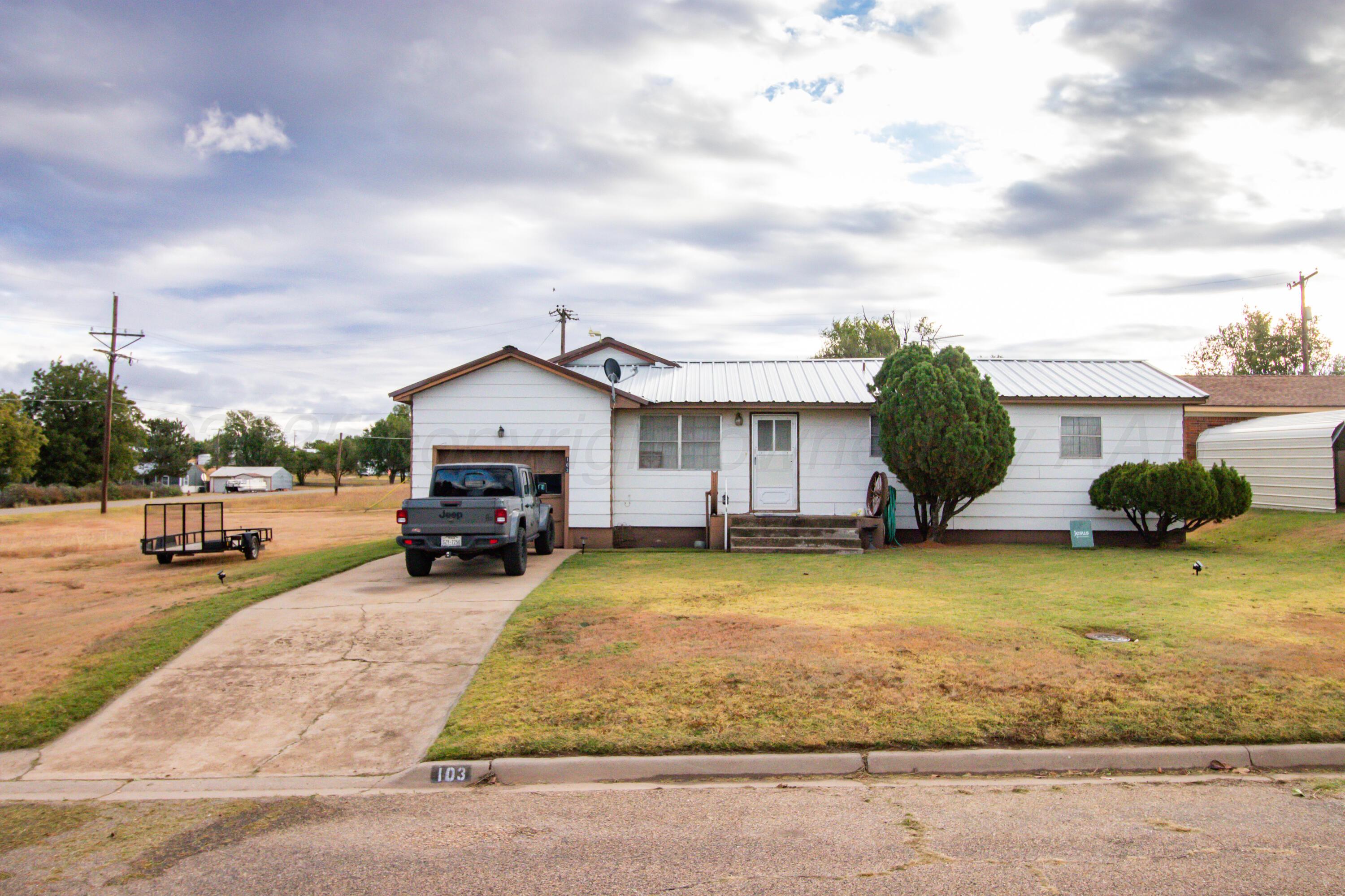 a view of a house with swimming pool and sitting area
