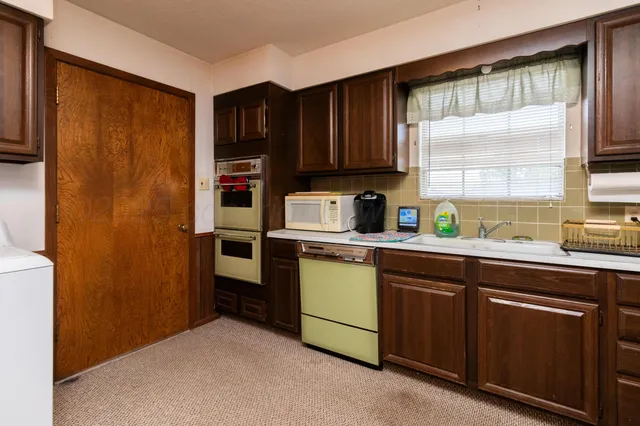 a view of storage and utility room with washer and dryer