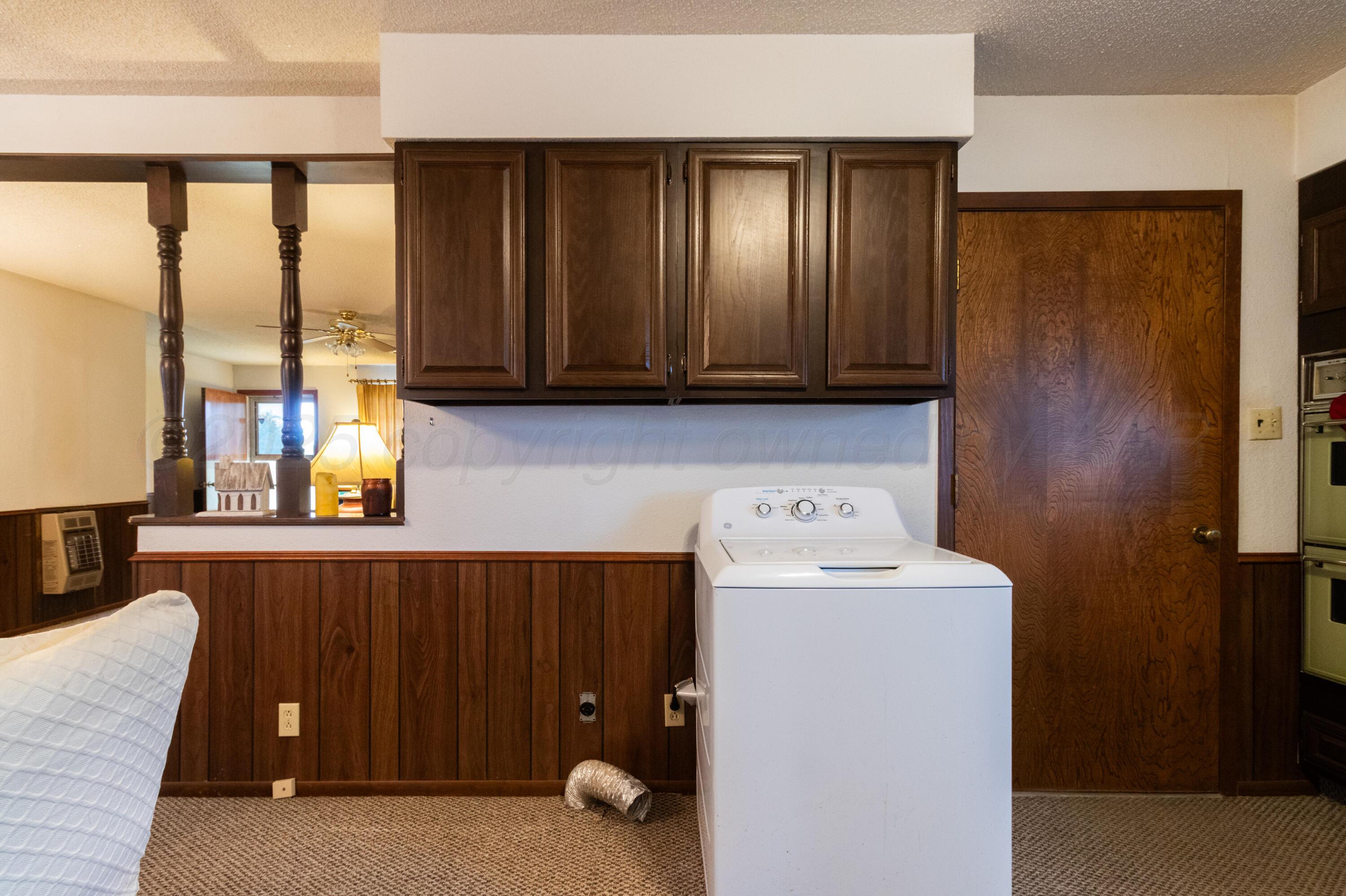 103 Jefferson Street Skellytown, TX 79080 - Photo 15 of 35 a view of storage and utility room with washer and dryer