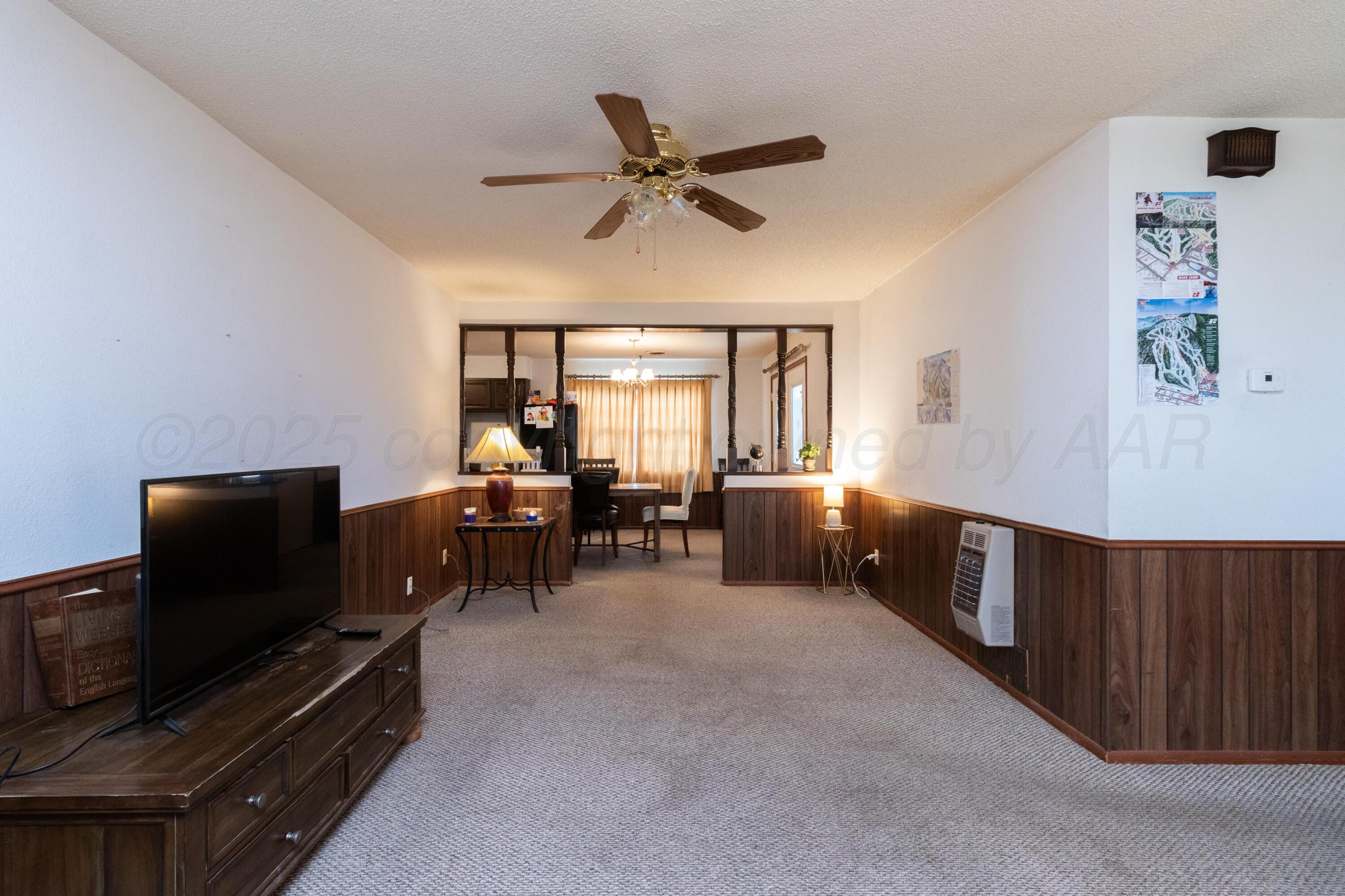 103 Jefferson Street Skellytown, TX 79080 - Photo 10 of 35 a living room with furniture and a flat screen tv