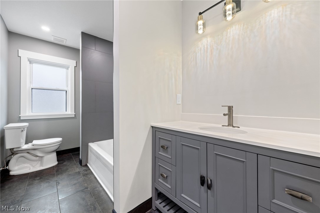 3679 Call Road Perry, OH 44081 - Photo 23 of 41 Bathroom featuring vanity, toilet, and tile flooring