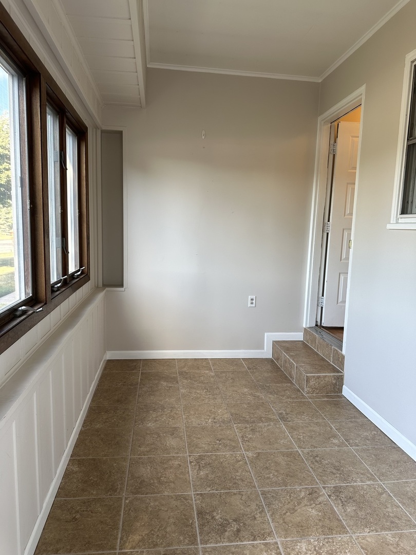 1691 Bilter Road Aurora, IL 60502 - Photo 15 of 19 a view of an empty room with a window