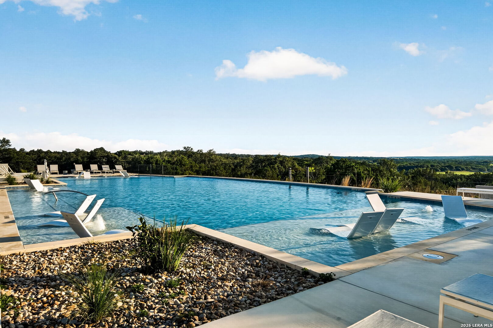 5386 Ranch Road 1376, Unit 64 Fredericksburg, TX 78624 - Photo 26 of 45 a view of a lake with couches in the background