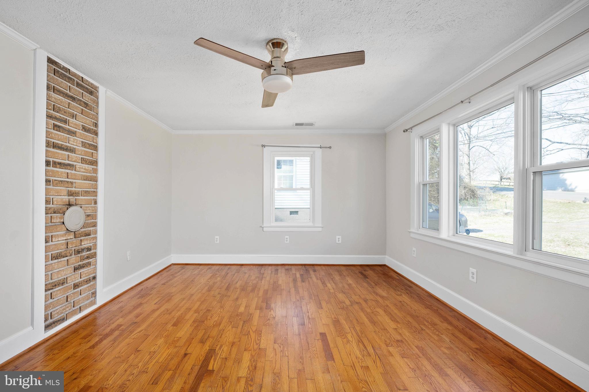 246 Berry Street Orange, VA 22960 - Photo 11 of 46 a view of empty room with wooden floor and fan