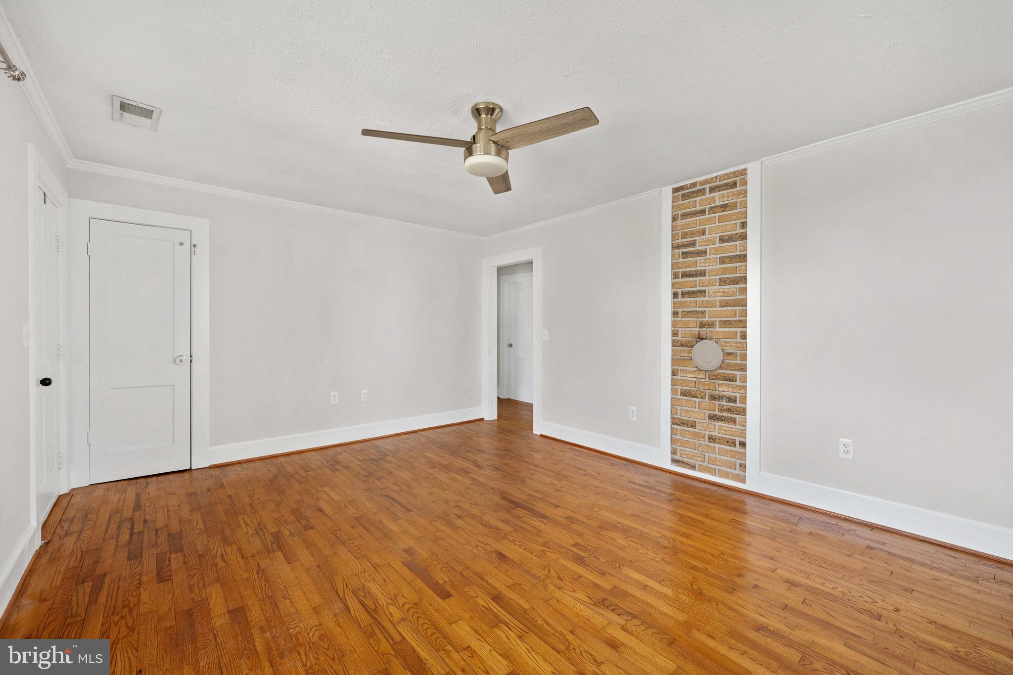 246 Berry Street Orange, VA 22960 - Photo 14 of 46 a view of an empty room with wooden floor and a window